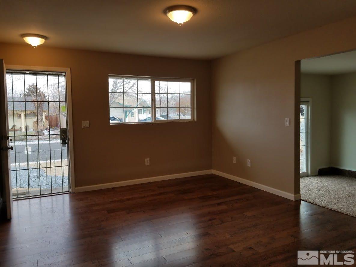 1270 Butler Street Reno, NV 89512 - Photo 5 of 22 wooden floor in an empty room with a window