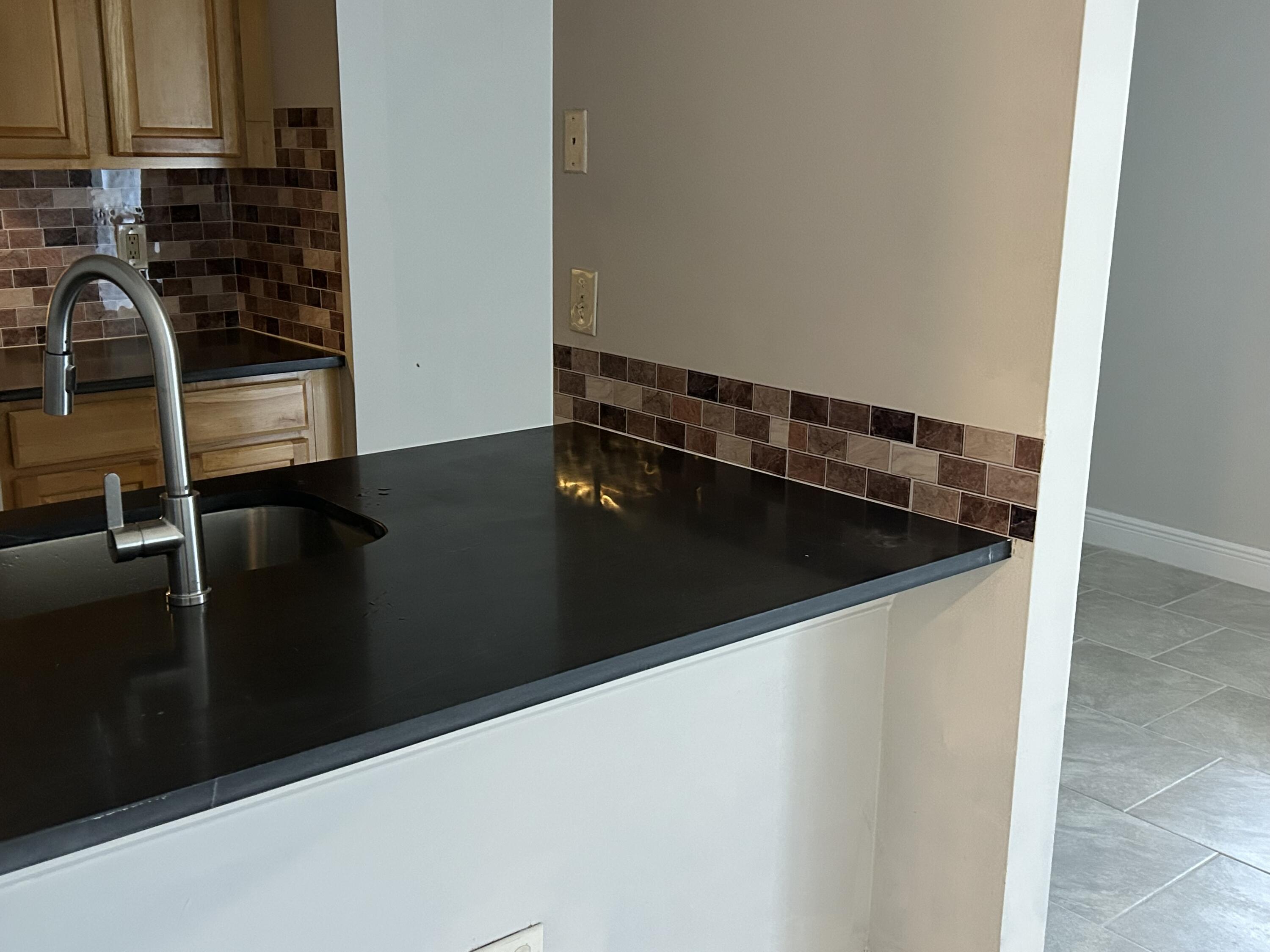 813 Meadows Circle, Unit 813 Boynton Beach, FL 33436 - Photo 2 of 5 a close view of kitchen sink