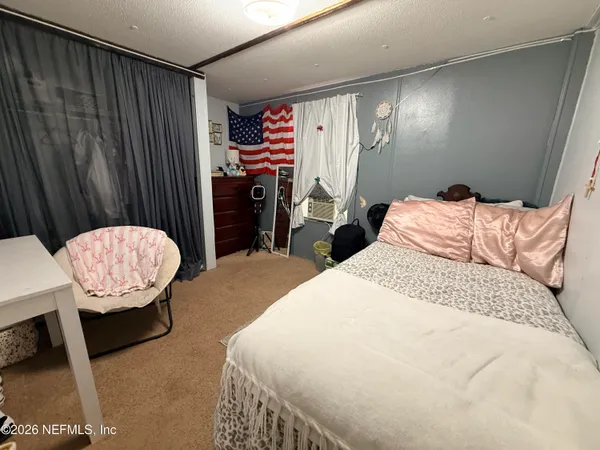 a bathroom with a sink mirror and toilet