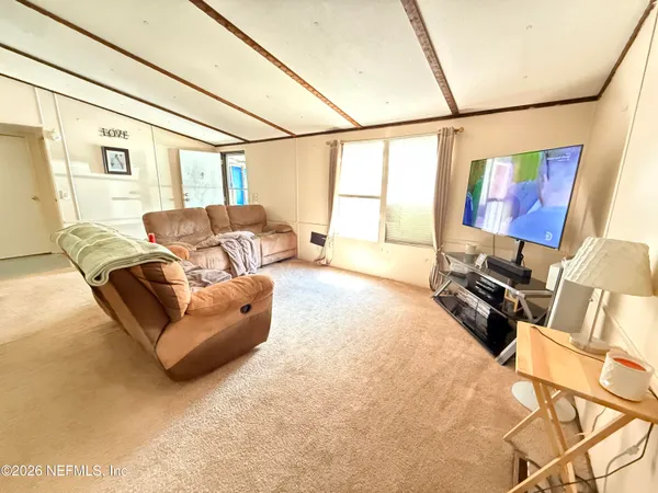 a view of a workspace with furniture