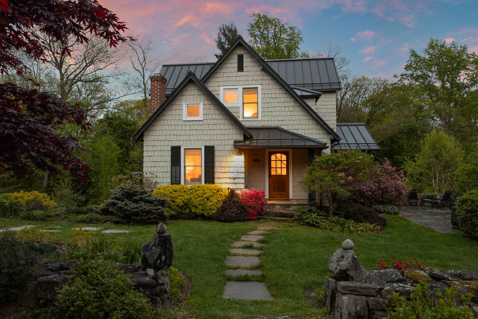 a front view of house with garden