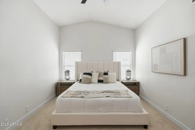 a bedroom with a bed and a night stand