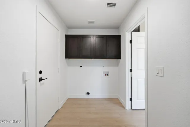 a view of hallway with wooden floor
