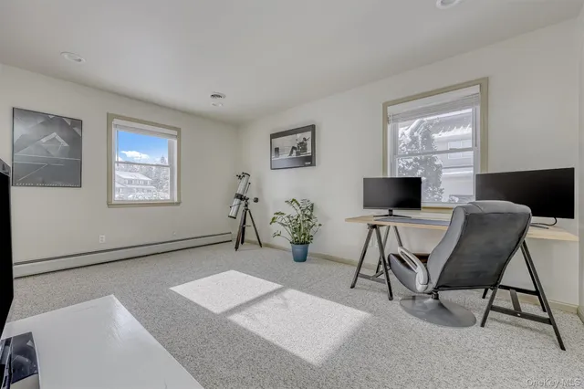 a workspace with furniture and window