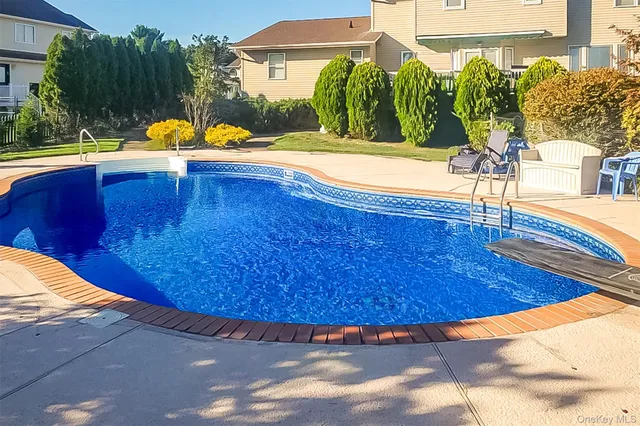 a view of a swimming pool with a patio