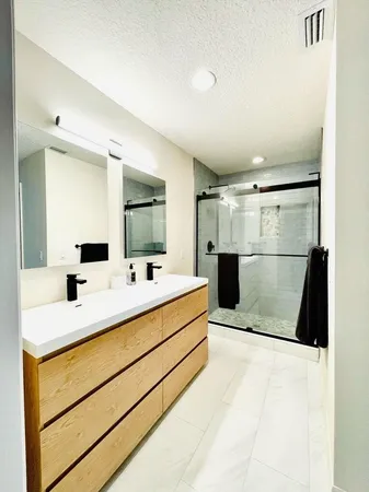 a bathroom with a sink and a mirror