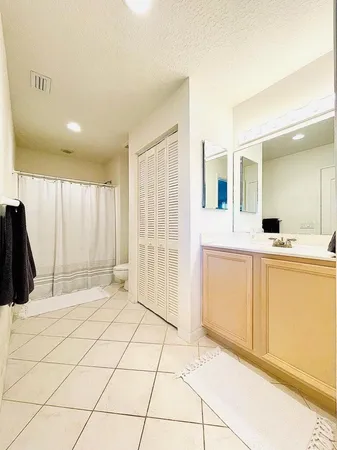 a view of a bathroom with sink and mirror