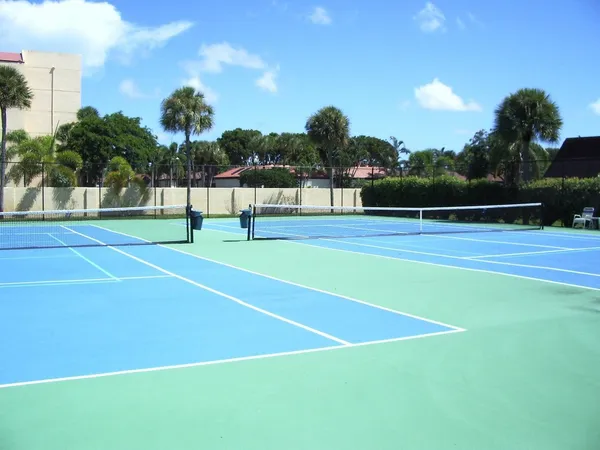 a view of an outdoor space and tennis court