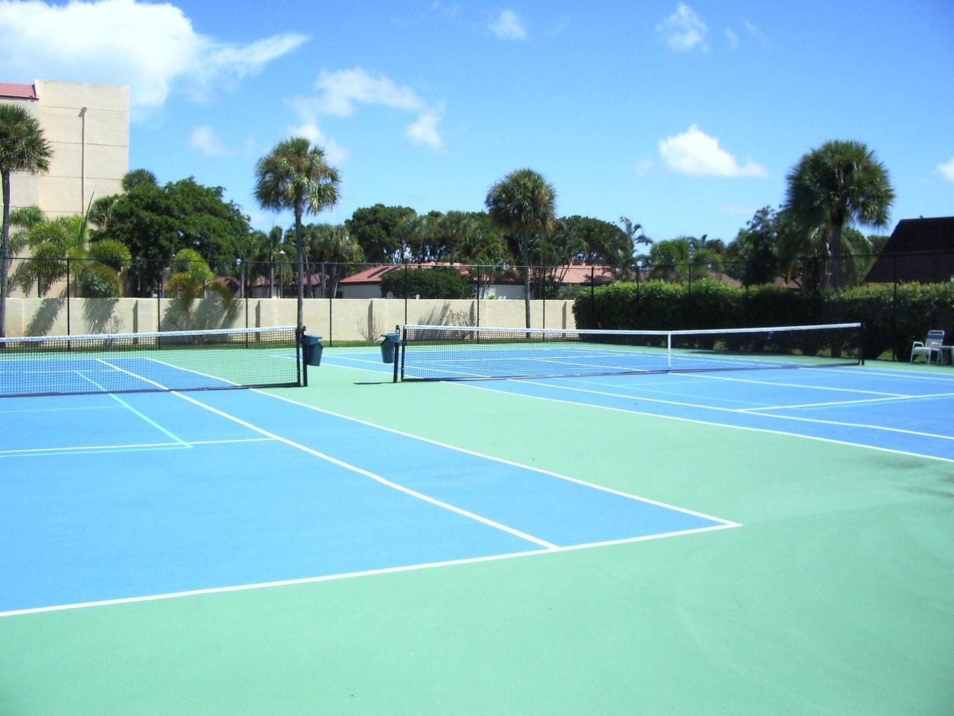1420 Ocean Way Drive, Unit 32C Jupiter, FL 33477 - Photo 24 of 25 a view of an outdoor space and tennis court
