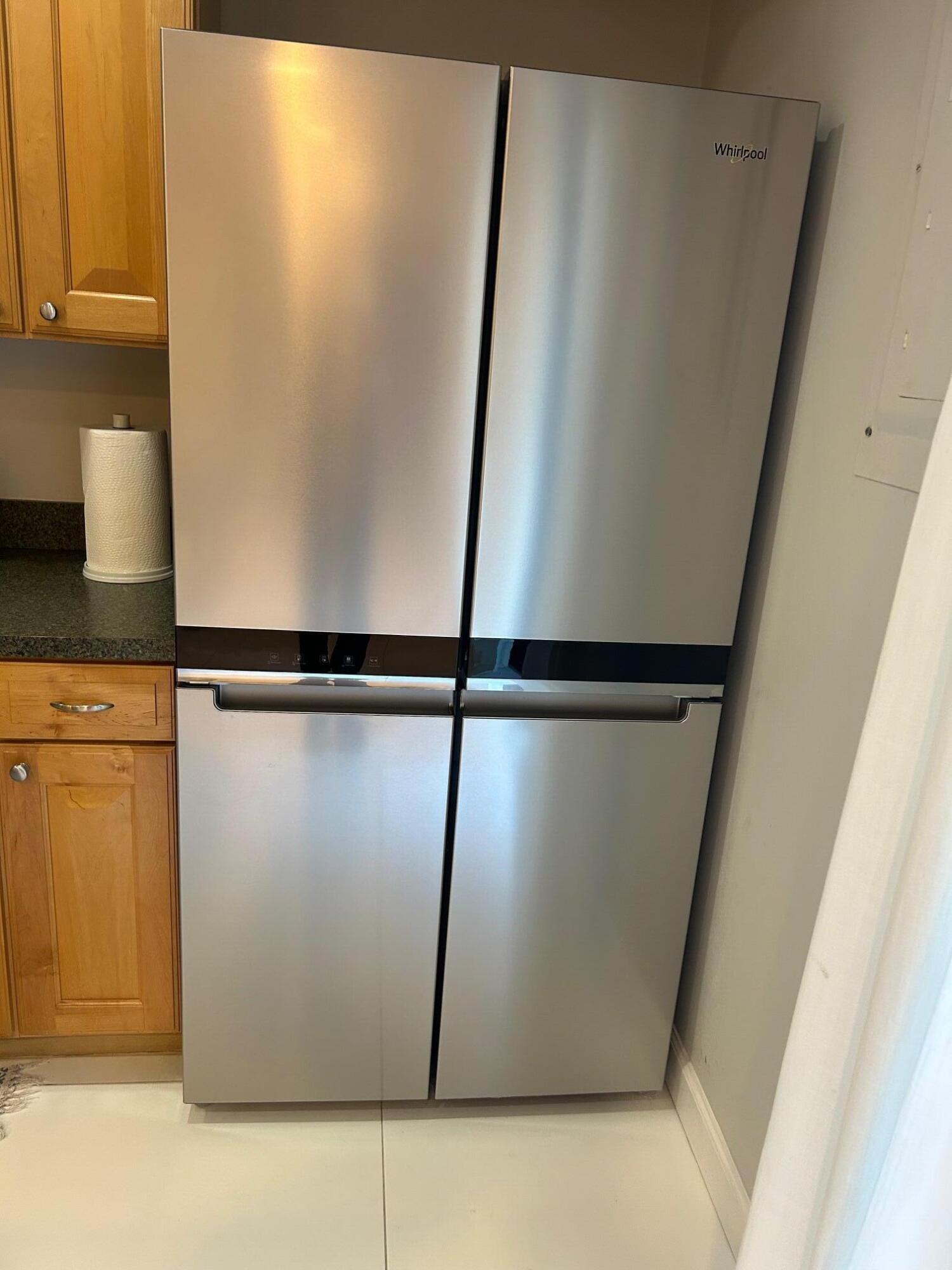 1420 Ocean Way Drive, Unit 32C Jupiter, FL 33477 - Photo 5 of 25 a view of a refrigerator