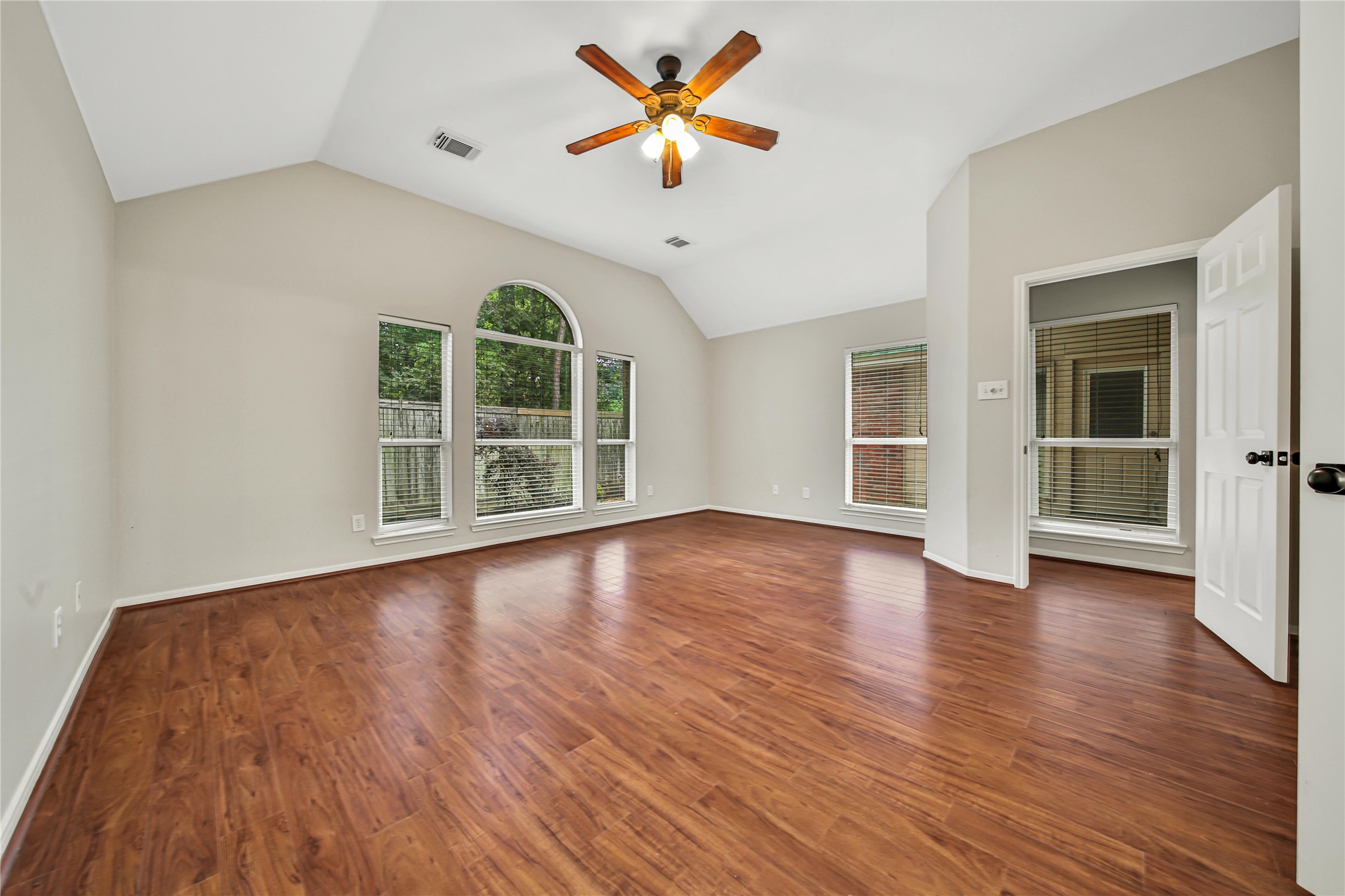 14526 Red Tailed Hawk Lane Houston, TX 77044 - Photo 39 of 40 a view of a room with wooden floor and a ceiling fan