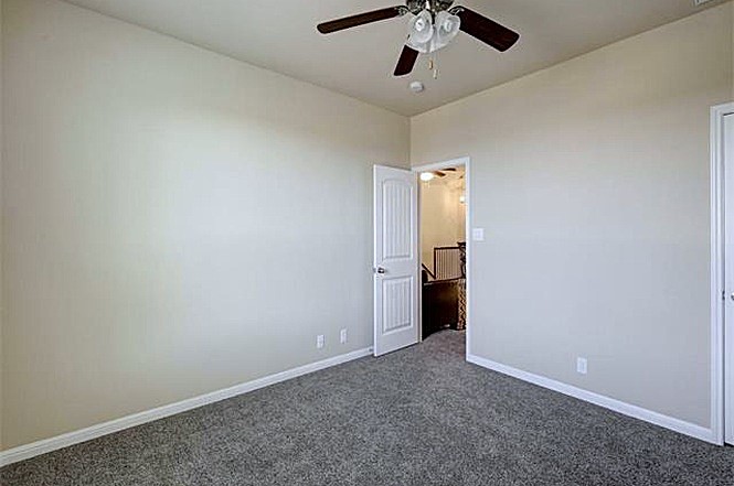 14001 Avery Ranch Boulevard, Unit 801 Austin, TX 78717 - Photo 23 of 26 Comfortable carpeting and a ceiling fan create a peaceful retreat in this room.