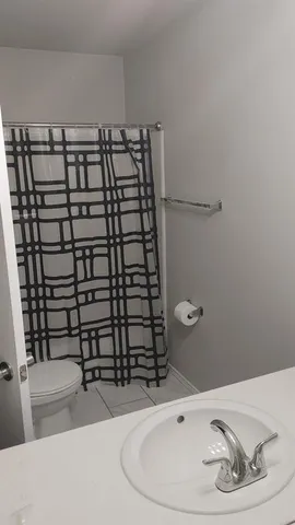 a bathroom with a bathtub and shower