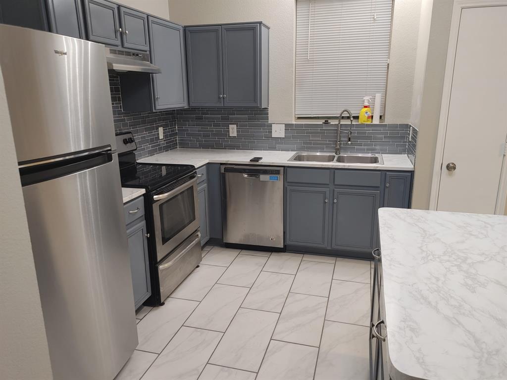 2645 Ezekial Way Plano, TX 75074 - Photo 3 of 16 a kitchen with stainless steel appliances granite countertop a refrigerator a sink a stove a microwave and island