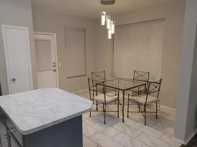 a view of a dining room and chandelier