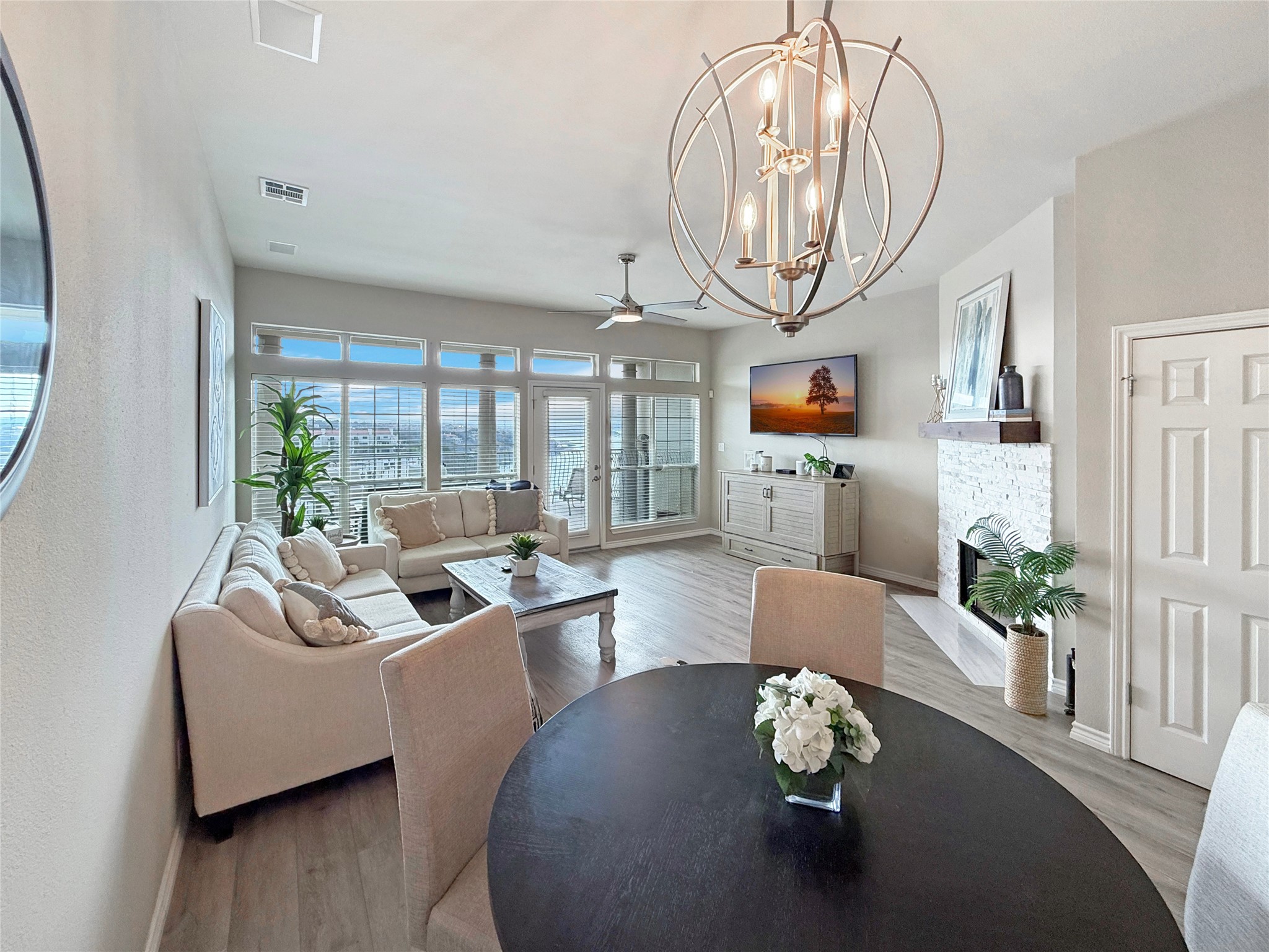 2918 Ranch Road 620 North, Unit Y199 Austin, TX 78734 - Photo 12 of 39 a living room with furniture wooden floor and a chandelier