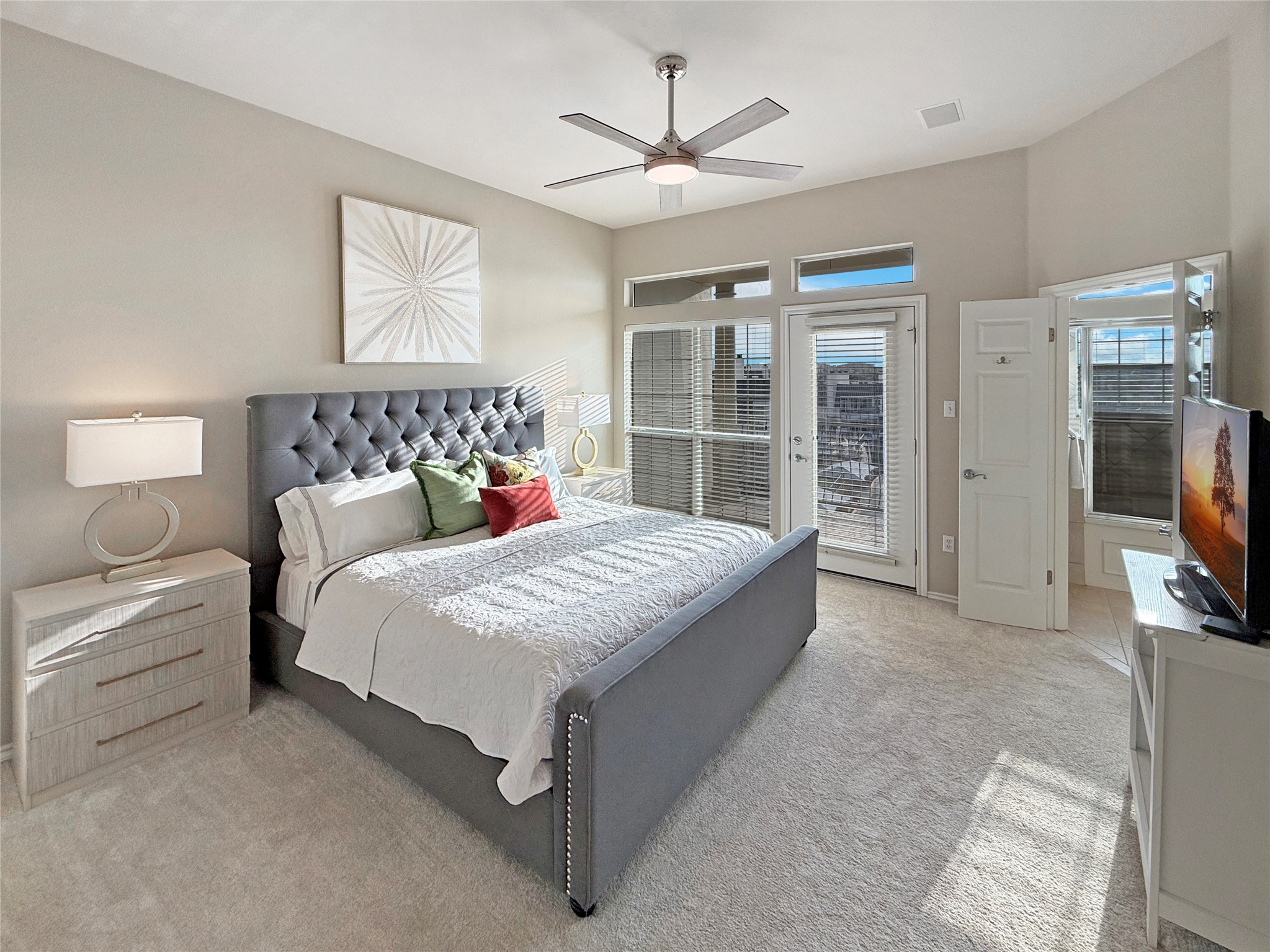 2918 Ranch Road 620 North, Unit Y199 Austin, TX 78734 - Photo 21 of 39 a spacious bedroom with a large bed and a chandelier