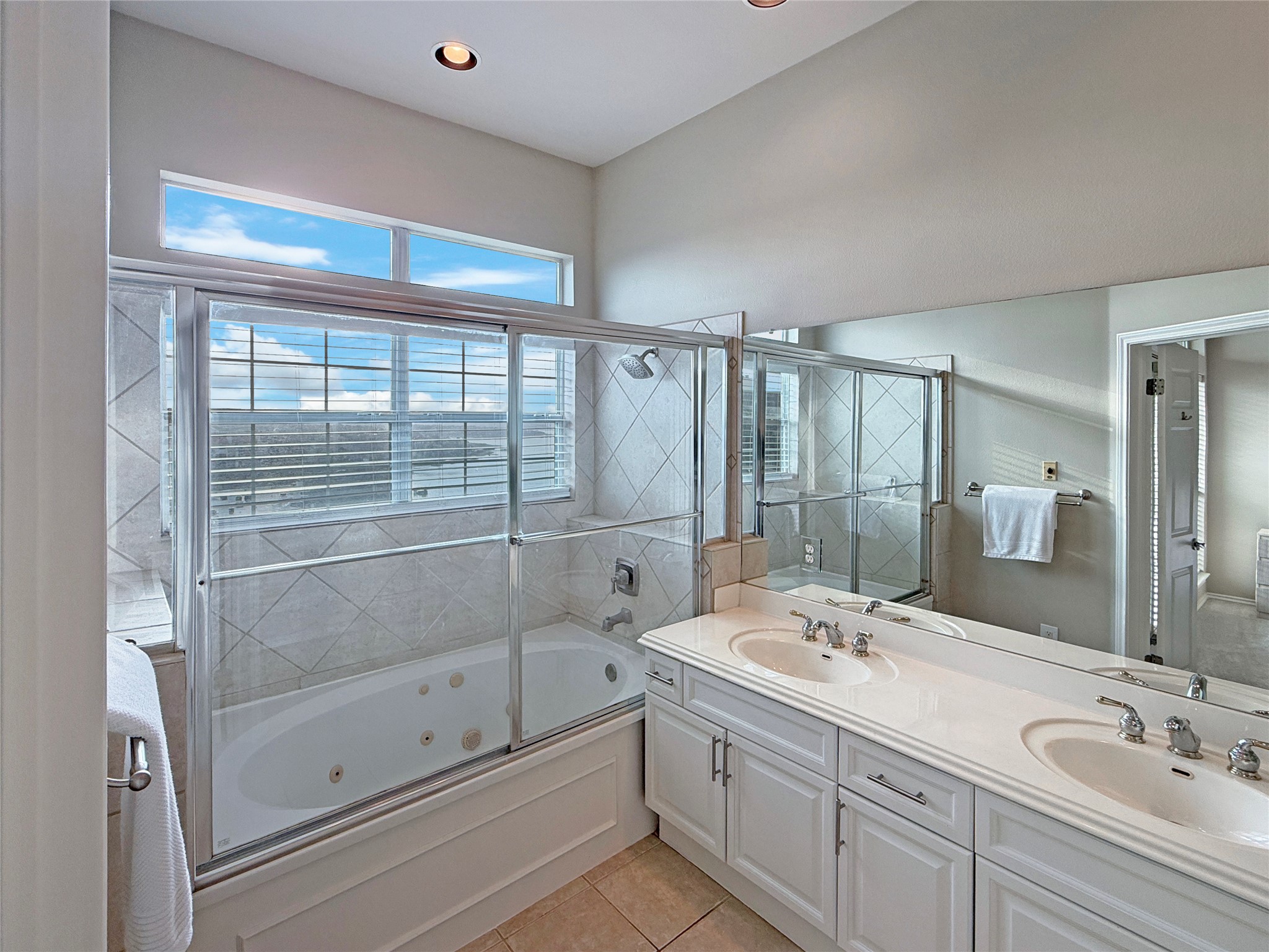 2918 Ranch Road 620 North, Unit Y199 Austin, TX 78734 - Photo 26 of 39 a bathroom with a shower sink and mirror