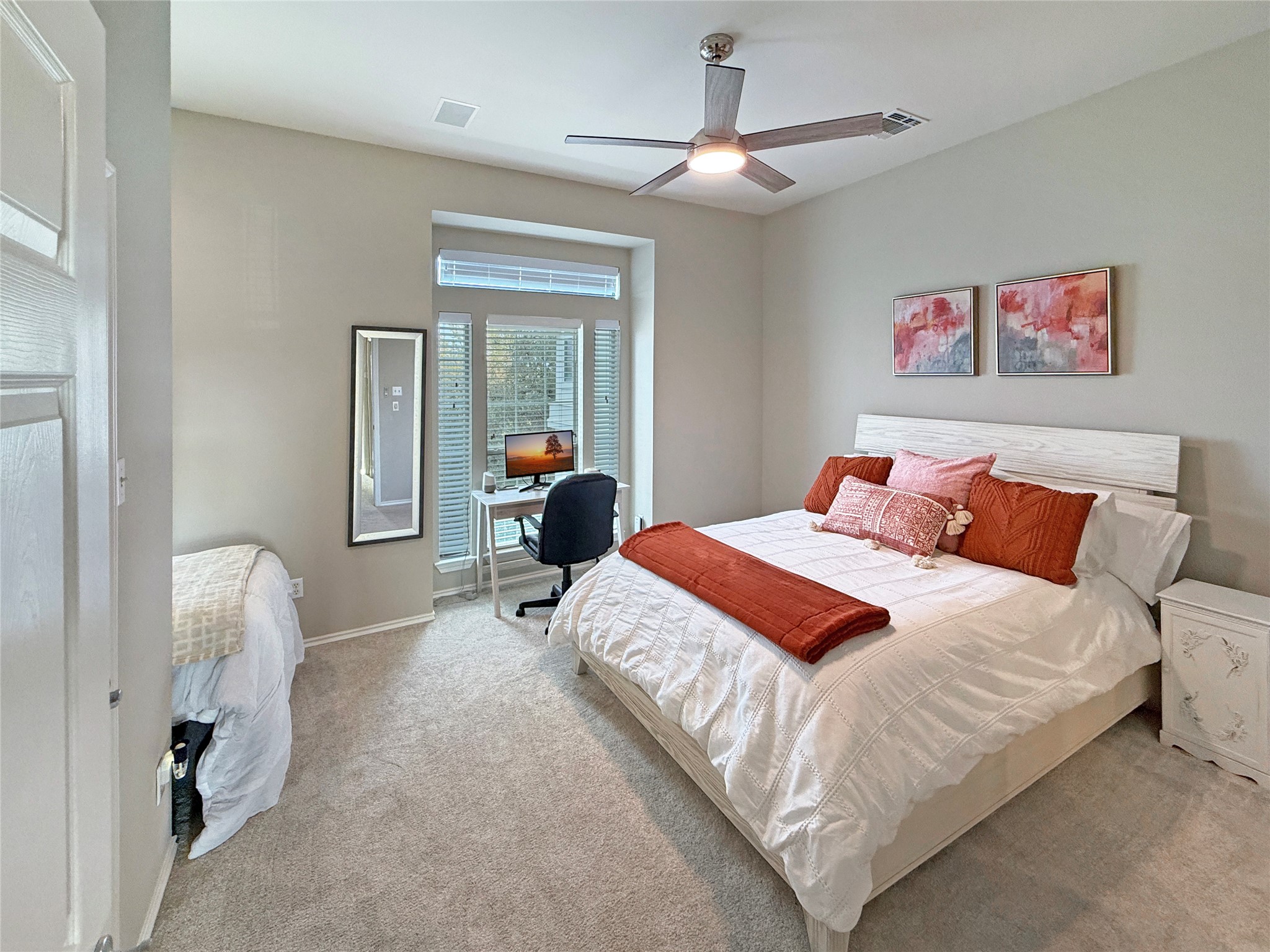 2918 Ranch Road 620 North, Unit Y199 Austin, TX 78734 - Photo 27 of 39 a bedroom with bed and a chandelier