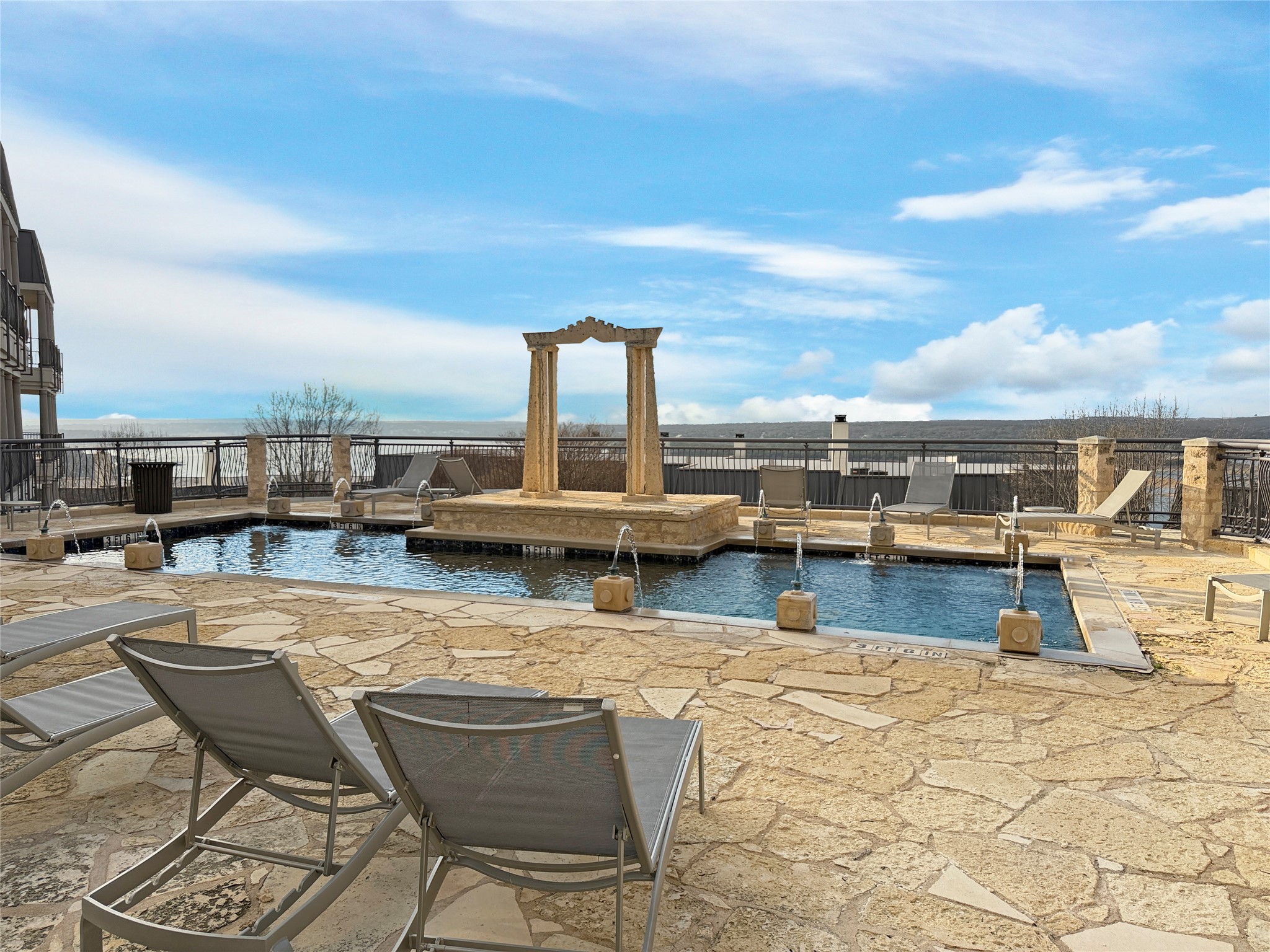 2918 Ranch Road 620 North, Unit Y199 Austin, TX 78734 - Photo 31 of 39 a view of a swimming pool with a lounge chairs