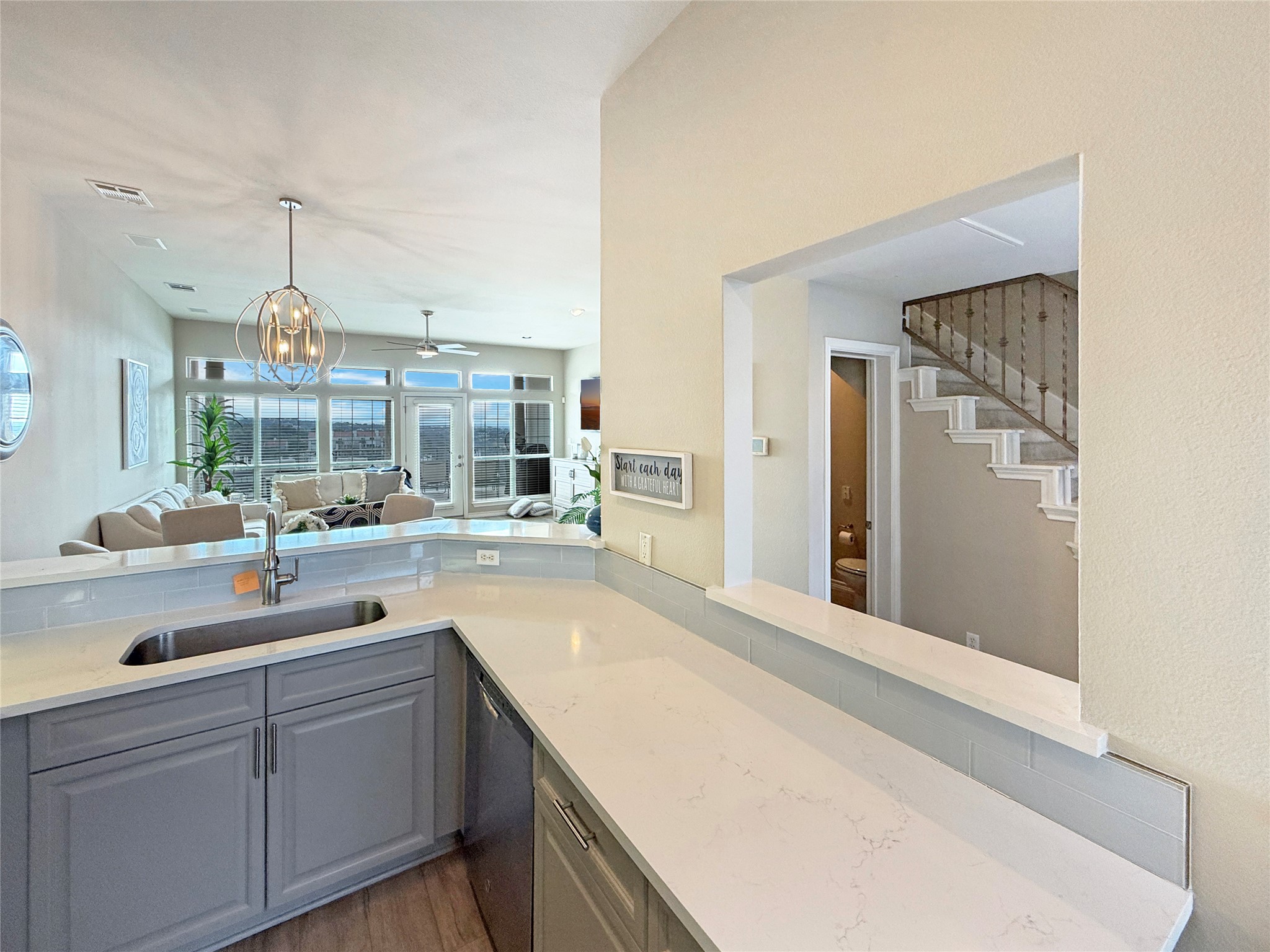 2918 Ranch Road 620 North, Unit Y199 Austin, TX 78734 - Photo 9 of 39 a view of a kitchen with a sink and wooden floor