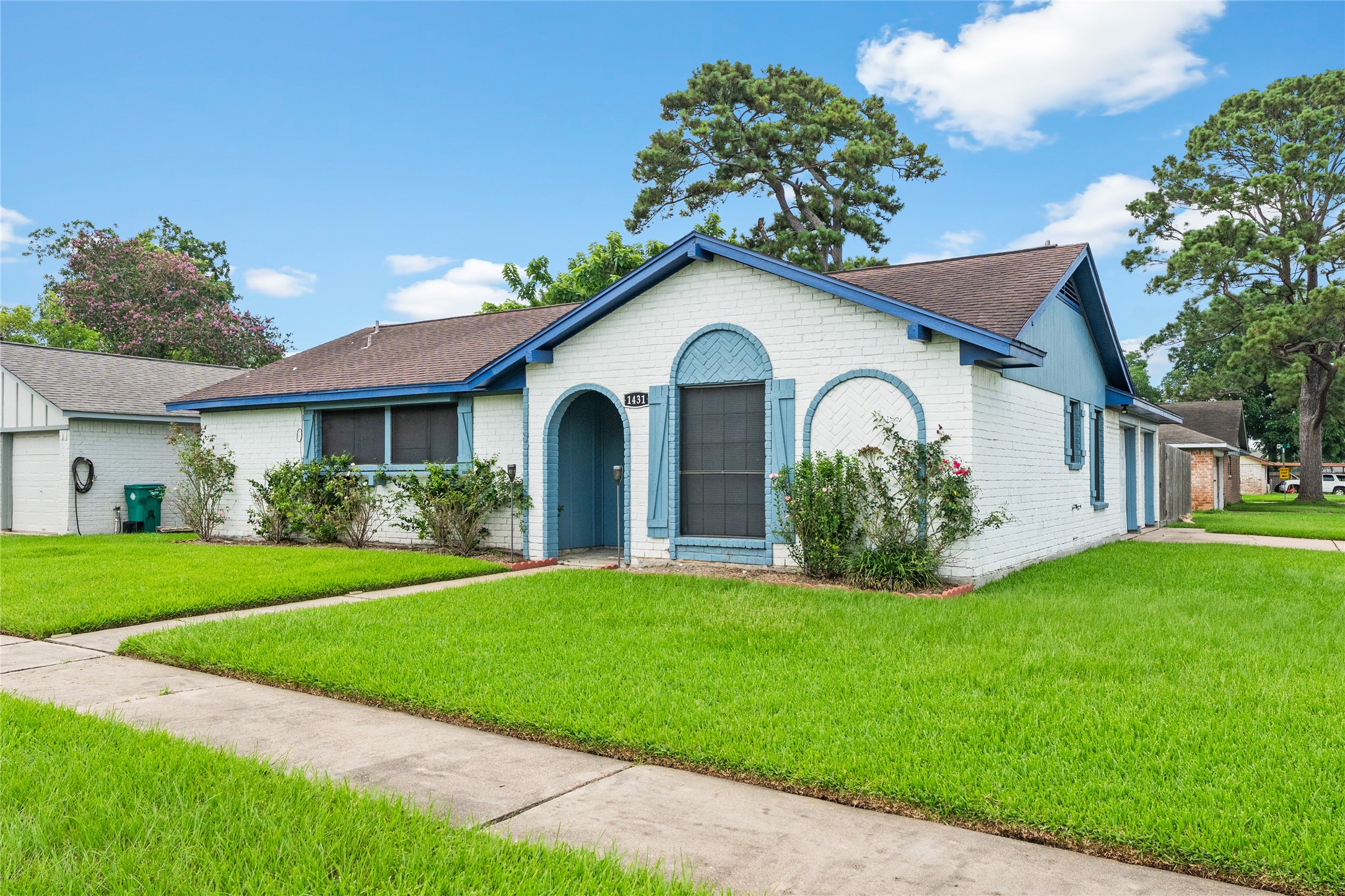 1431 Epsilon Street Pasadena, TX 77504 - Photo 3 of 21 a front view of a house with a garden