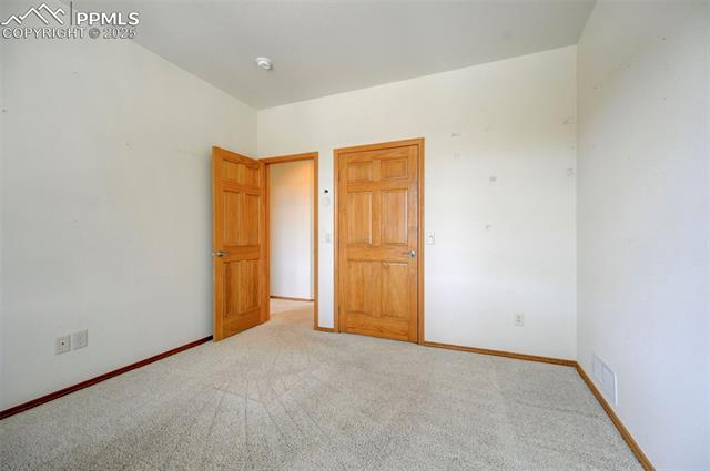 15091 Ridgefield Lane Colorado Springs, CO 80921 - Photo 19 of 35 Empty room featuring carpet floors