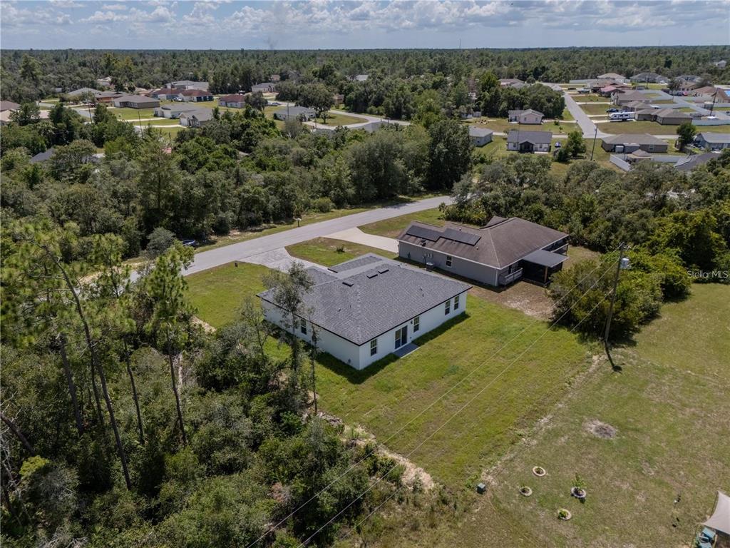 14245 Southwest 28th Court Ocala, FL 34473 - Photo 12 of 84 an aerial view of a house with a garden