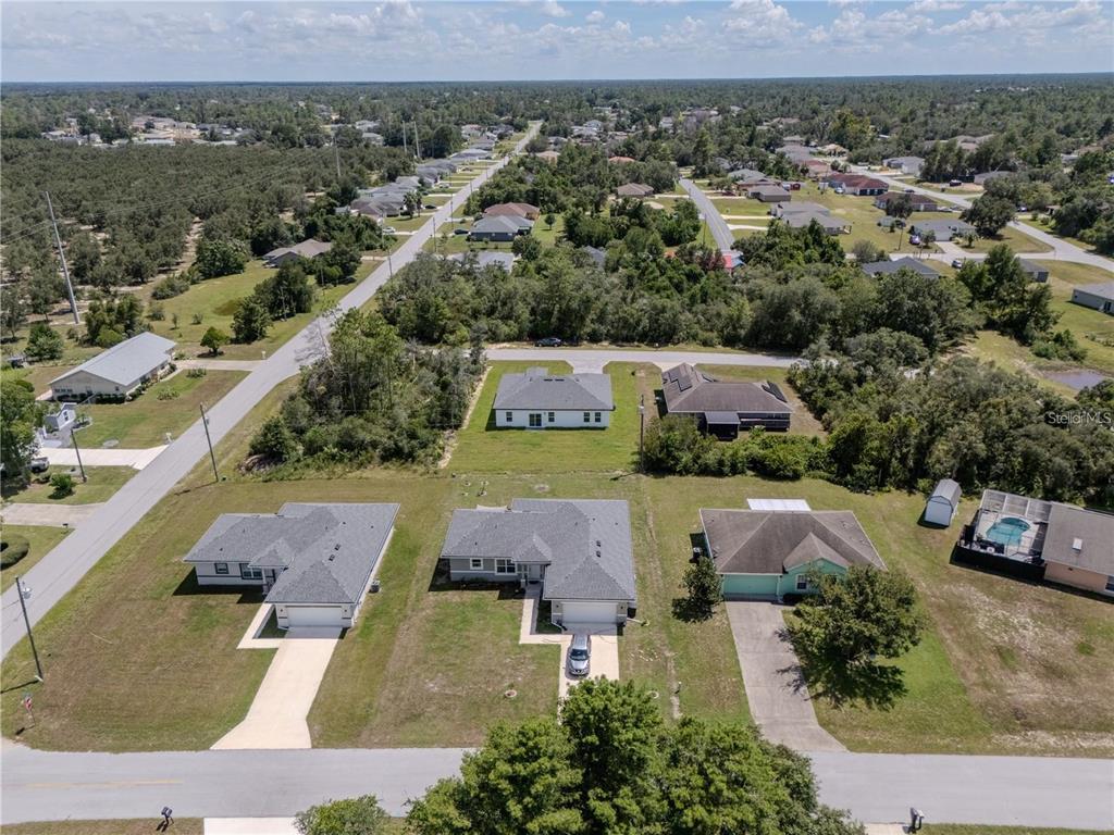 14245 Southwest 28th Court Ocala, FL 34473 - Photo 16 of 84 an aerial view of a house with a garden