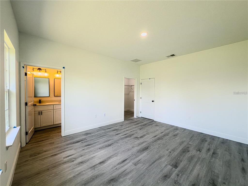 14245 Southwest 28th Court Ocala, FL 34473 - Photo 51 of 84 a view of a kitchen cabinets and wooden floor