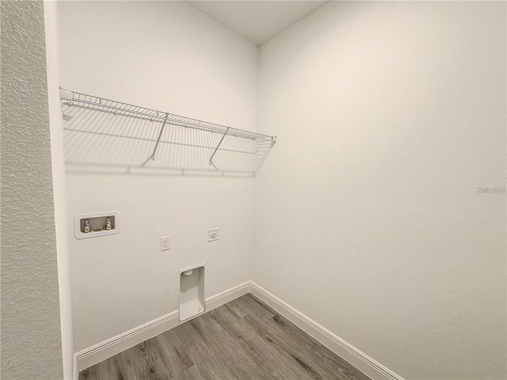 14245 Southwest 28th Court Ocala, FL 34473 - Photo 66 of 84 a view of a room with racks on the wall