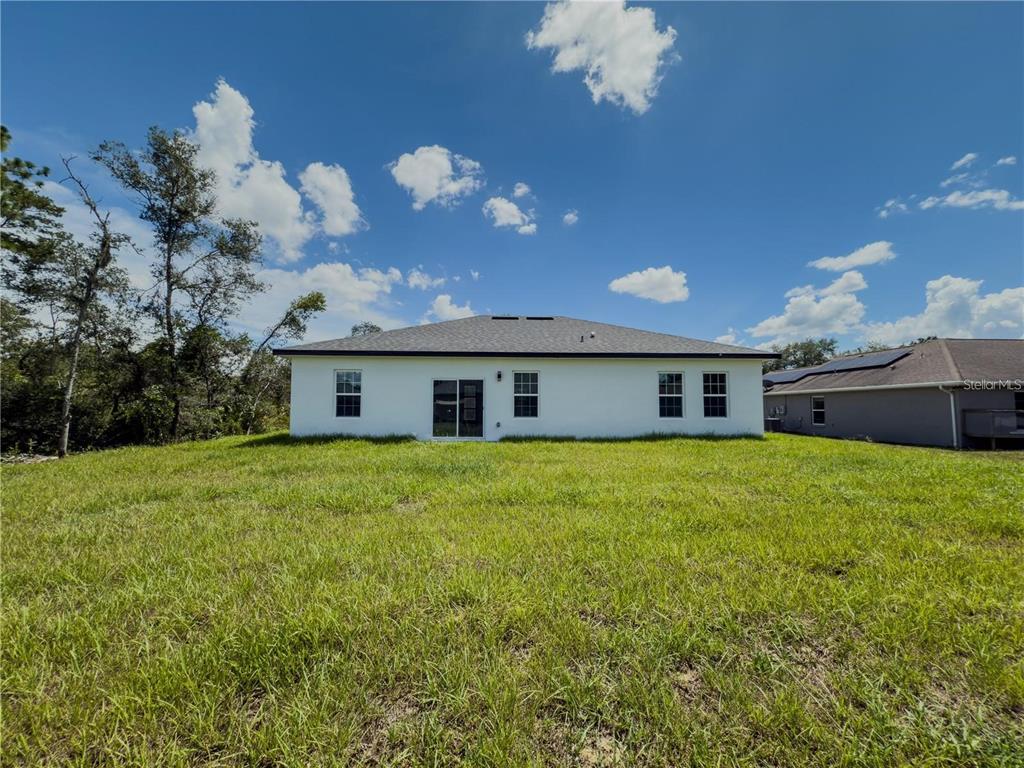 14245 Southwest 28th Court Ocala, FL 34473 - Photo 78 of 84 a front view of house with yard and seating area