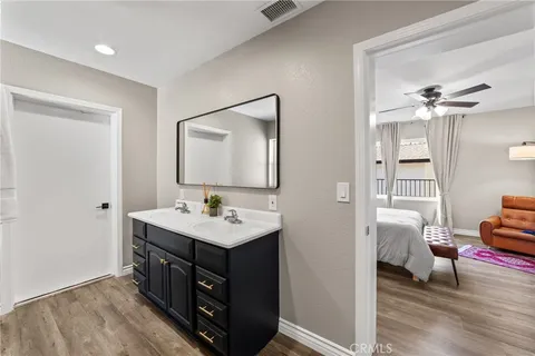 a bathroom with a sink toilet and mirror