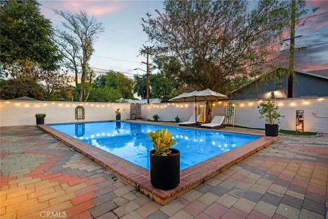 a view of a swimming pool with a lounge chairs