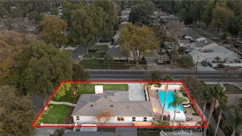 an aerial view of house with yard