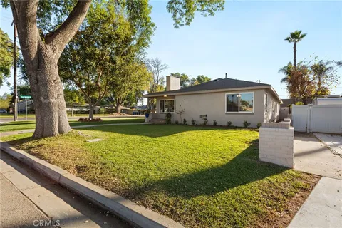 a view of a swimming pool with a yard
