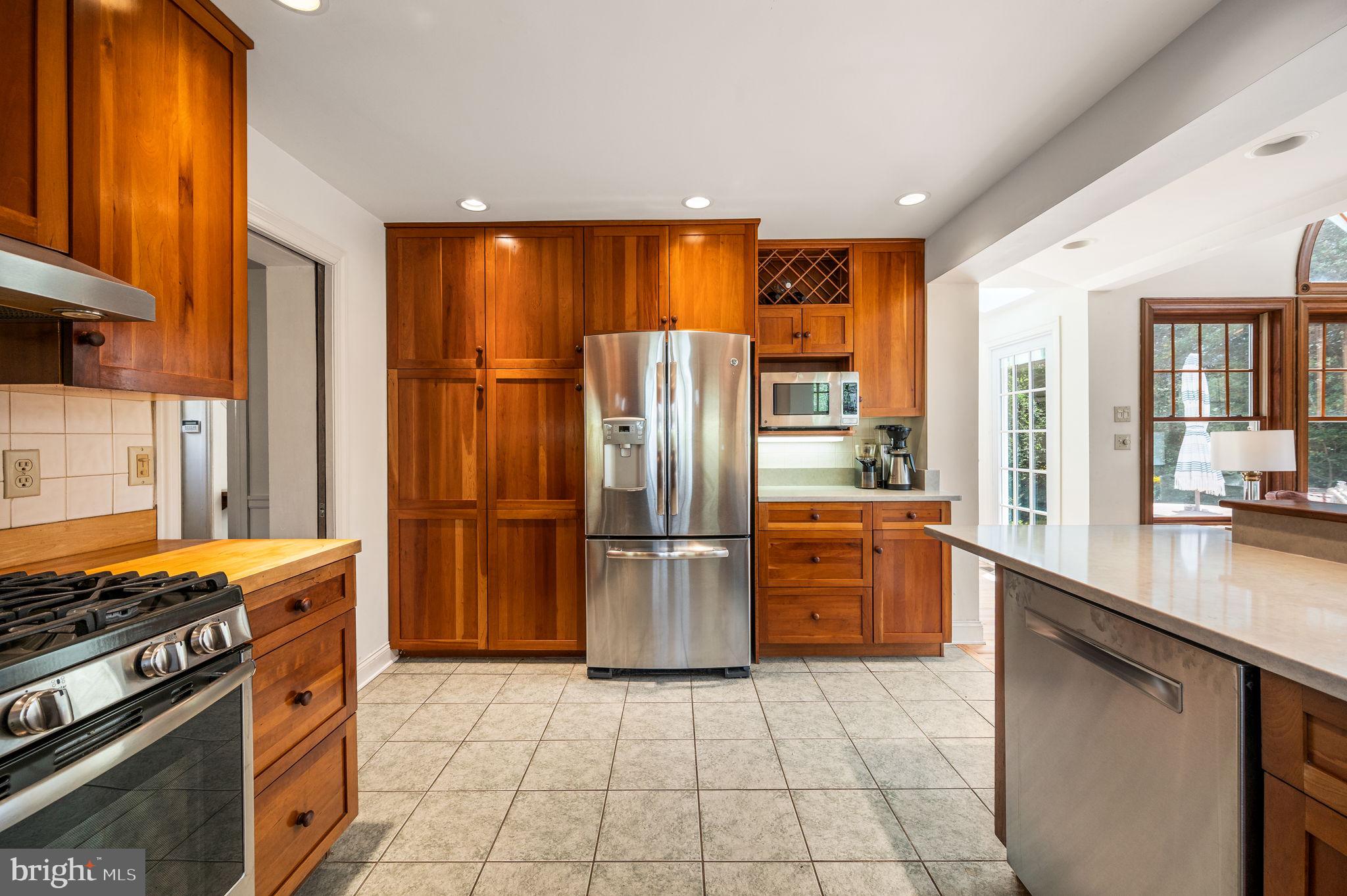 320 Riverview Road Swarthmore, PA 19081 - Photo 11 of 38 a kitchen with a stove a refrigerator and a sink