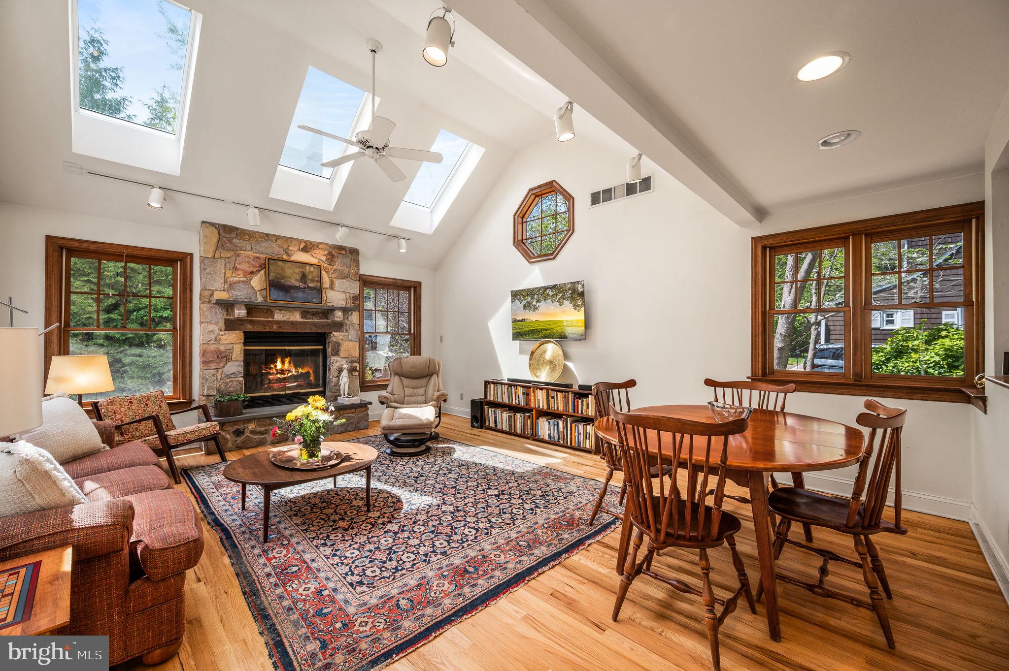 320 Riverview Road Swarthmore, PA 19081 - Photo 12 of 38 a living room with fireplace furniture and a large window