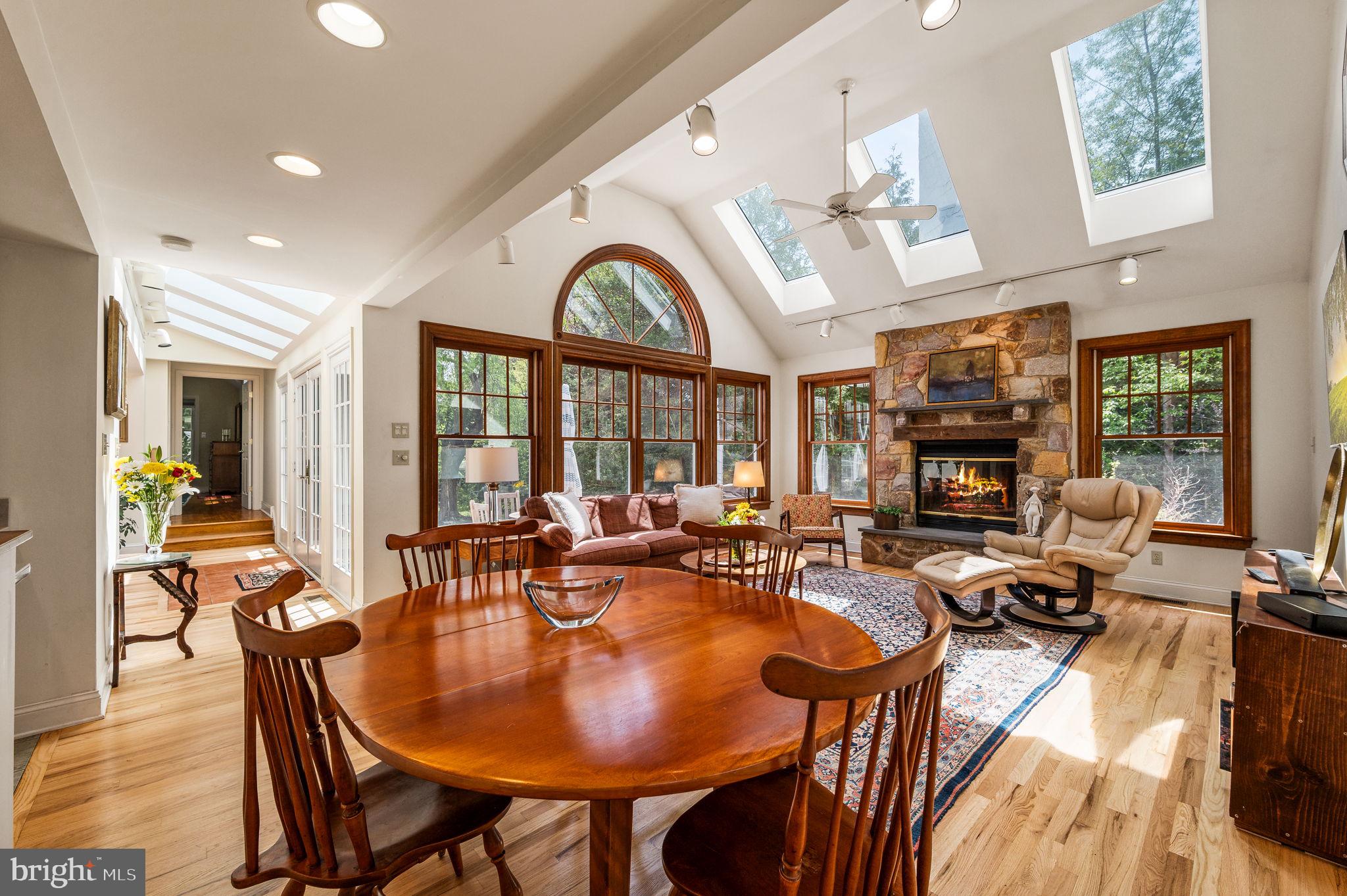 320 Riverview Road Swarthmore, PA 19081 - Photo 13 of 38 a living room with fireplace furniture and a large window
