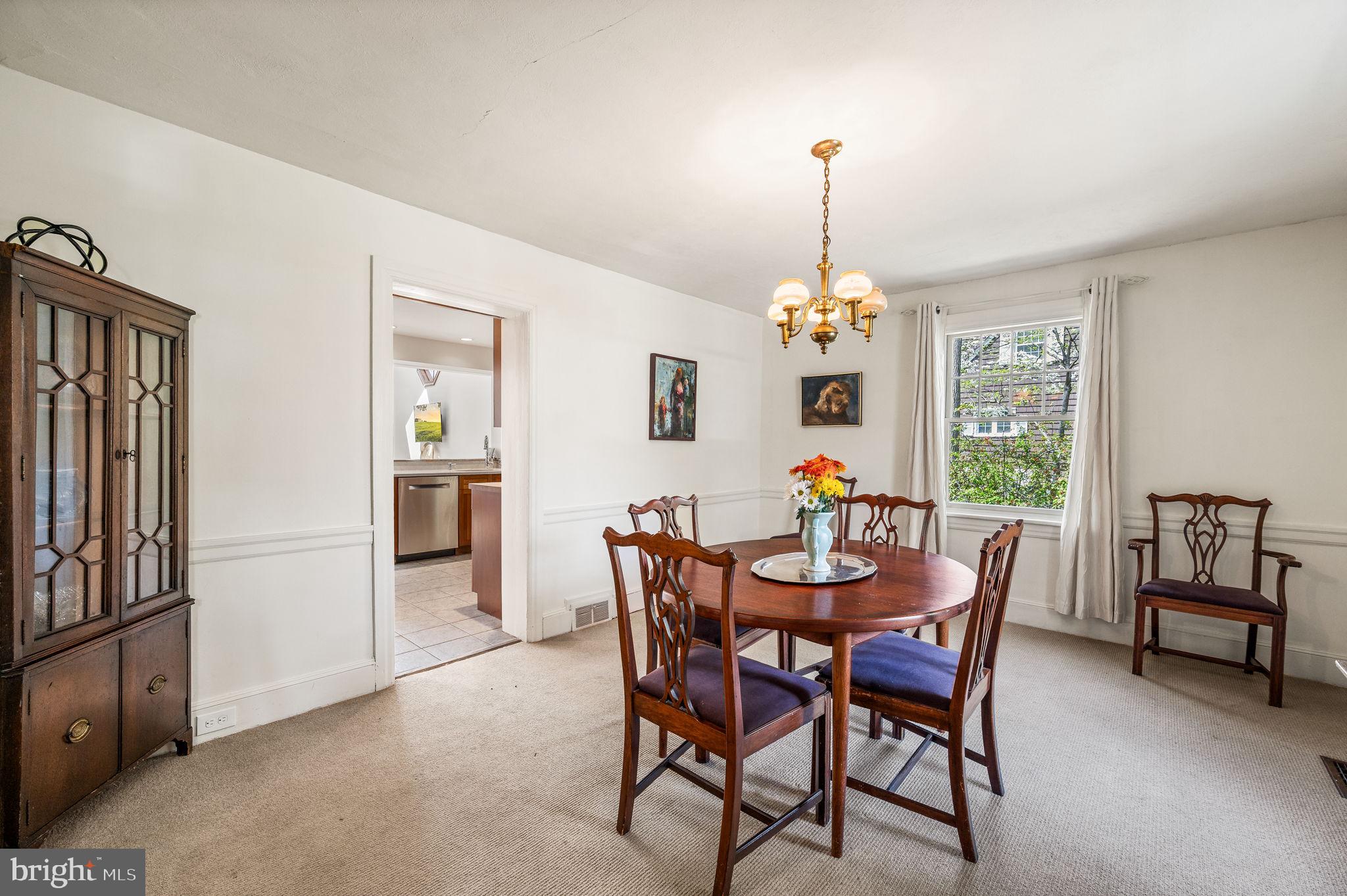 320 Riverview Road Swarthmore, PA 19081 - Photo 15 of 38 a dining room with furniture a chandelier and window