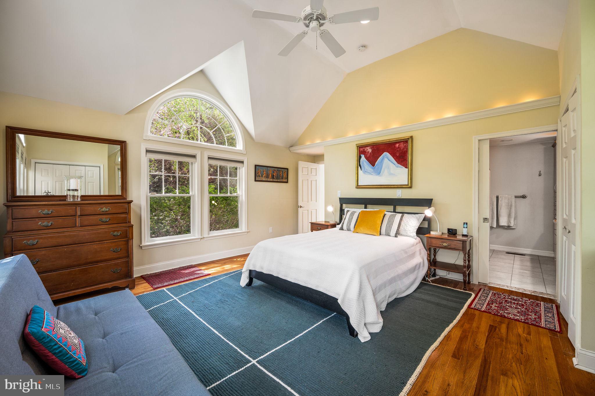 320 Riverview Road Swarthmore, PA 19081 - Photo 19 of 38 a spacious bedroom with a bed and wooden floor
