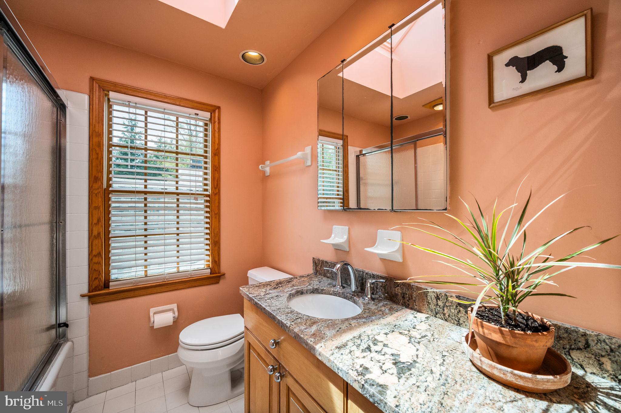 320 Riverview Road Swarthmore, PA 19081 - Photo 24 of 38 a bathroom with a granite countertop sink and a mirror