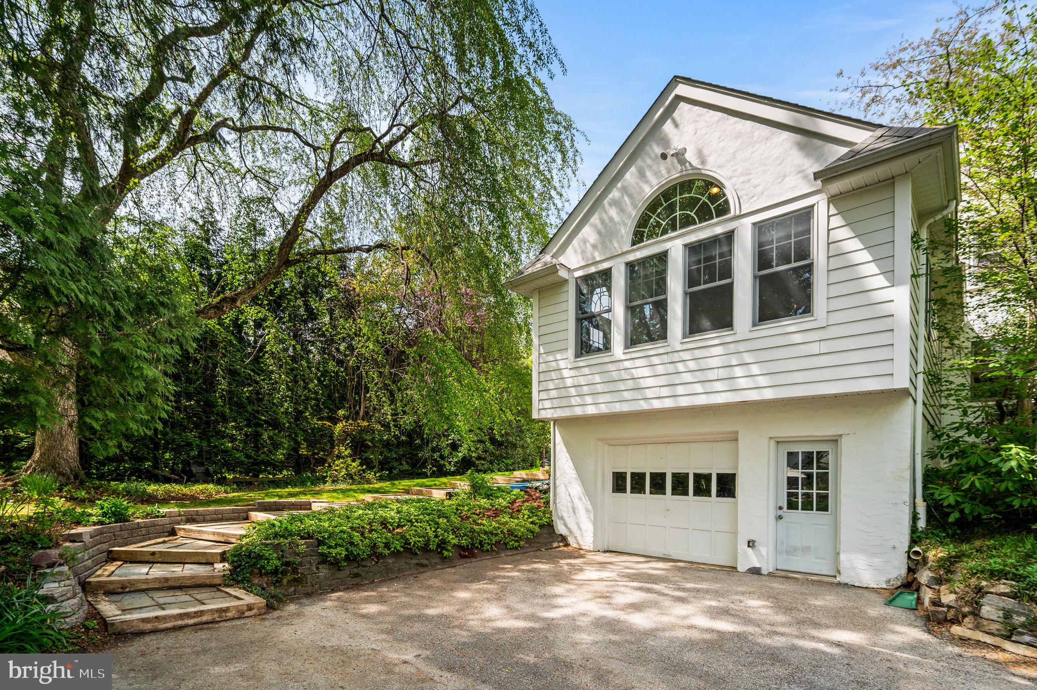 320 Riverview Road Swarthmore, PA 19081 - Photo 29 of 38 a front view of a house with a yard