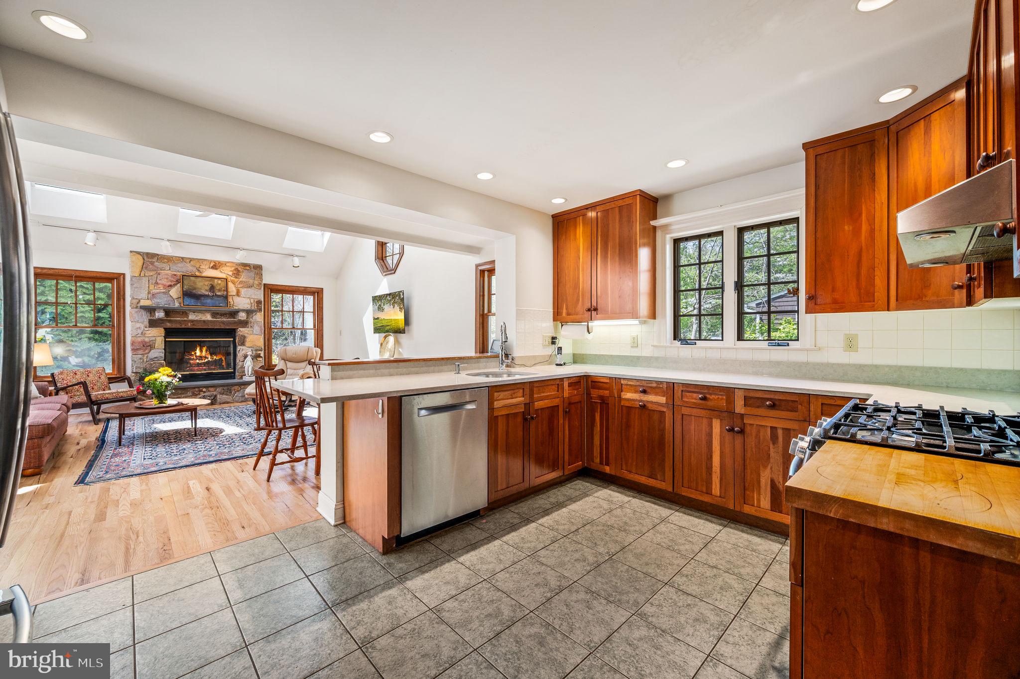 320 Riverview Road Swarthmore, PA 19081 - Photo 10 of 38 a kitchen with stainless steel appliances granite countertop a stove a sink and a microwave