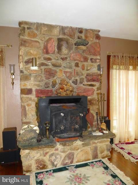 1383 Elk Forest Road Elkton, MD 21921 - Photo 5 of 30 LIVING ROOM STONE FIREPLACE HAS WOOD STOVE INSERT