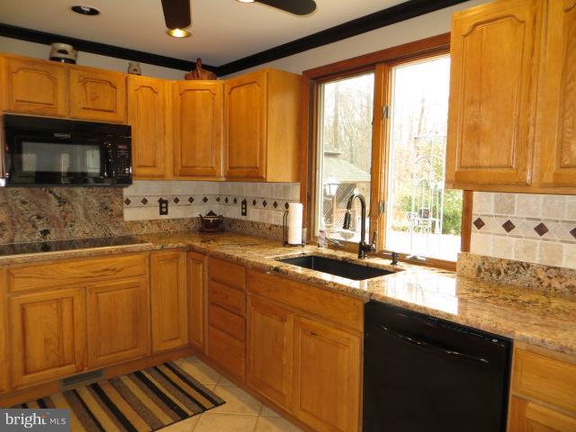 1383 Elk Forest Road Elkton, MD 21921 - Photo 9 of 30 HICKORY CABINETS AND TILE BACKSPLASH