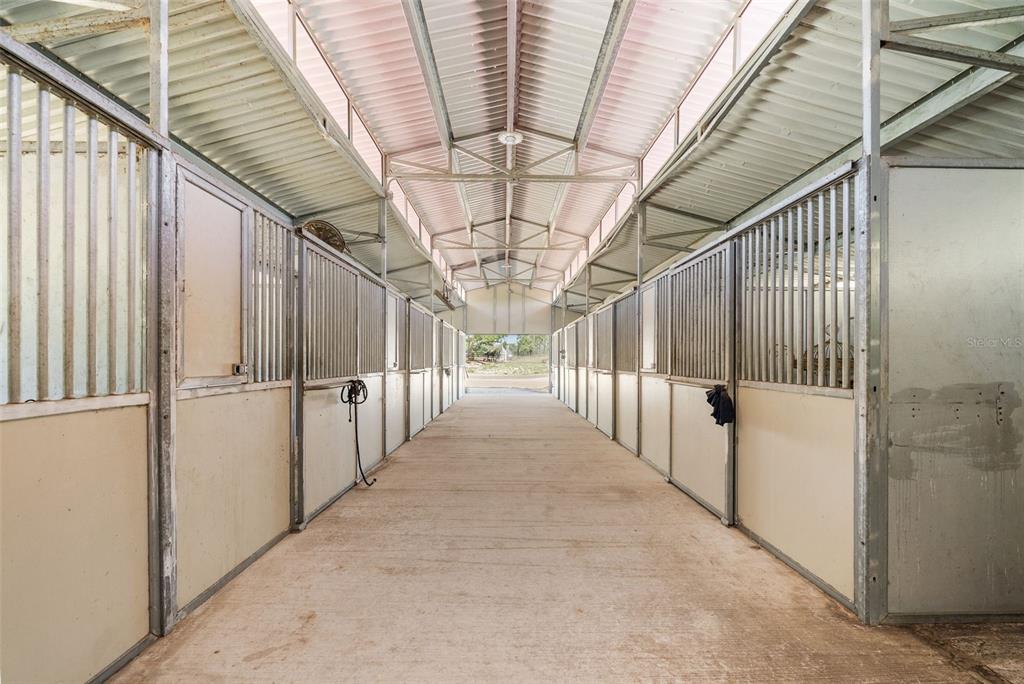 25723 Bareva Road Weeki Wachee, FL 34614 - Photo 15 of 55 a view of a hallway with wooden floor