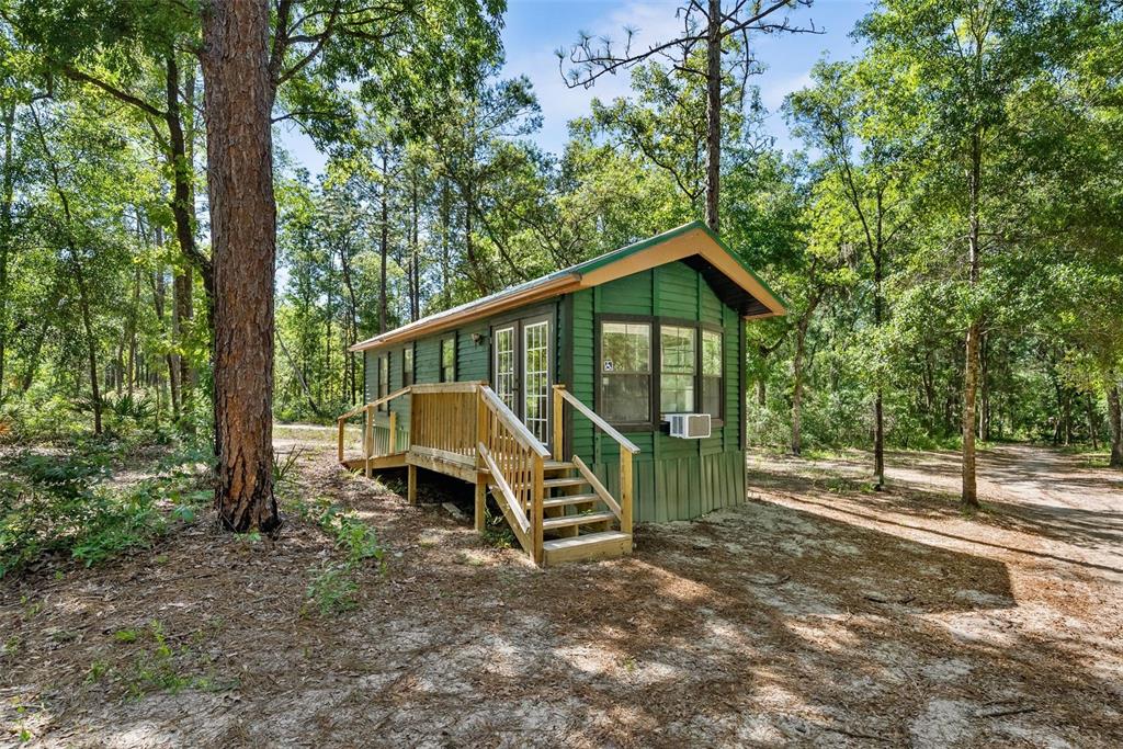 25723 Bareva Road Weeki Wachee, FL 34614 - Photo 26 of 55 a view of a house with a yard from a deck