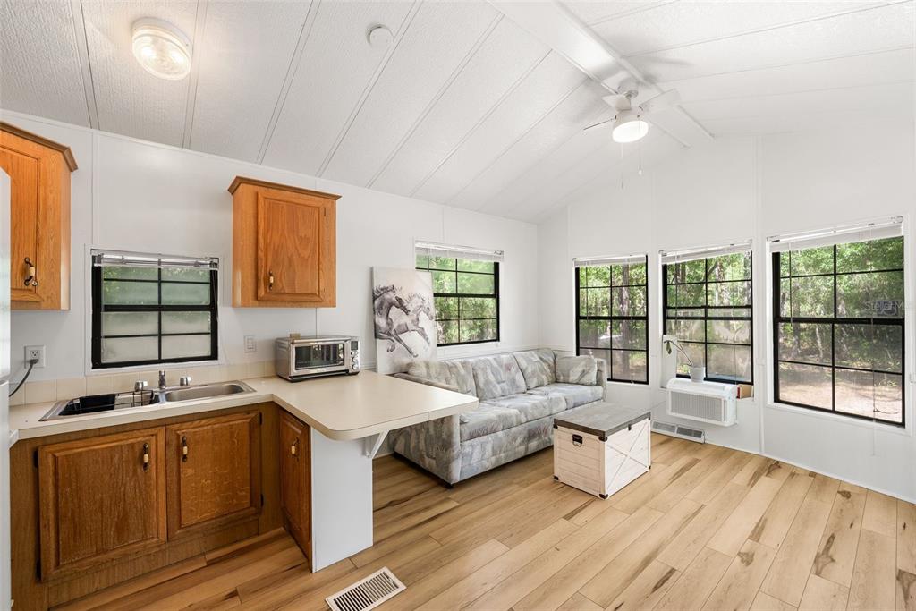 25723 Bareva Road Weeki Wachee, FL 34614 - Photo 37 of 55 a spacious bedroom with a large bed and a large window