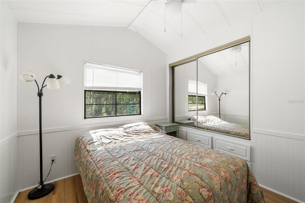 25723 Bareva Road Weeki Wachee, FL 34614 - Photo 38 of 55 a bedroom with a bed and a window